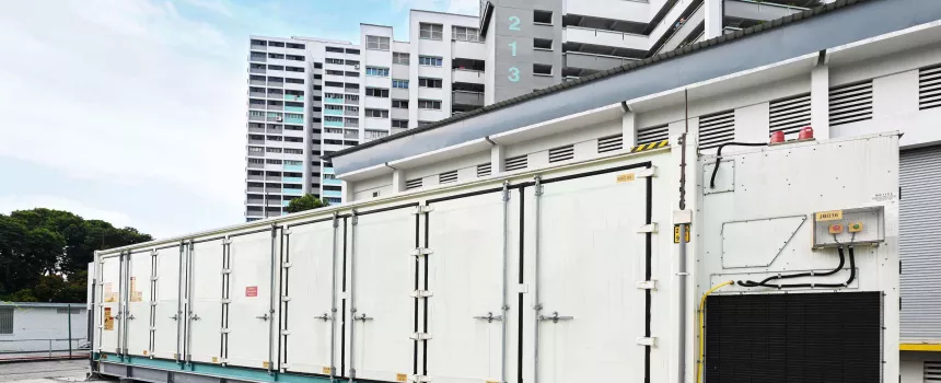 Energy storage containers with some buildings on the background. 